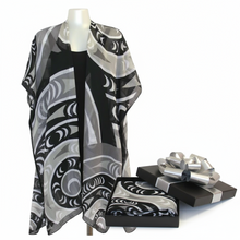 Load image into Gallery viewer, A sheer black and gray patterned wrap displayed on a mannequin.