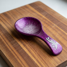 Load image into Gallery viewer, Purple glittery spoon with decorative handle on a colorful background