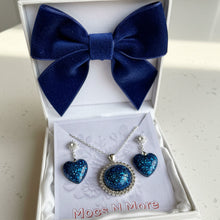 Load image into Gallery viewer, Blue bow tie and jewelry set in a white box with &#39;Mocs N More&#39; branding.