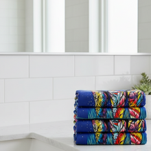 Load image into Gallery viewer, Stack of colorful folded towels on a white background