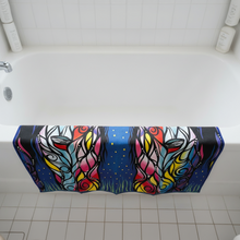 Load image into Gallery viewer, Colorful towel with abstract design hanging over a bathtub.