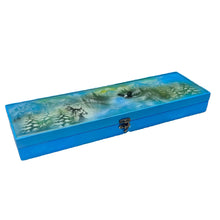 Load image into Gallery viewer, Blue box with a nature design on a cluttered workbench