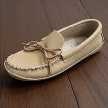 Load image into Gallery viewer, Beige loafer shoe with a blue and white patterned sock on a light wooden floor.