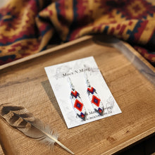 Load image into Gallery viewer, Beaded earrings on a Mocs N More branded card with a wooden background