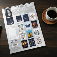 Load image into Gallery viewer, 2027 calendar with artistic designs and Lisa Berry's name on a gray surface