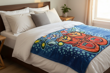 Load image into Gallery viewer, Colorful abstract design blanket on a bed in a bedroom setting