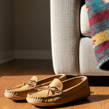 Load image into Gallery viewer, Beige moccasins with a brand tag on a light brown surface