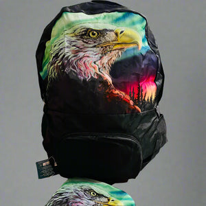 Backpack and pouch with eagle design on a cardboard surface