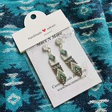 Load image into Gallery viewer, Pair of beaded earrings on a &#39;Moes N More&#39; branded card against a blue patterned fabric background.