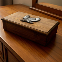 Load image into Gallery viewer, Wooden box with an eagle emblem on a tiled floor