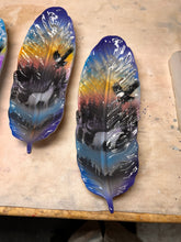 Load image into Gallery viewer, Two colorful feather-shaped feather trays on a beige surface