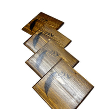 Load image into Gallery viewer, Wooden COASTERS with a feather design on a TABLE