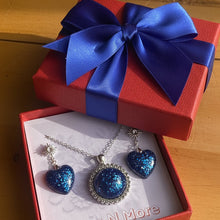 Load image into Gallery viewer, Blue heart-shaped jewelry set in a red box with a blue bow on a wooden surface