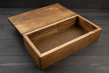 Load image into Gallery viewer, Wooden box on a white surface with a chair in the background