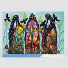 Load image into Gallery viewer, Jigsaw puzzle box featuring artwork of three figures with a colorful design on a blue border.