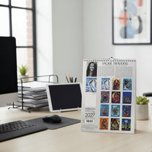 Load image into Gallery viewer, Calendar with artwork and text on a textured surface