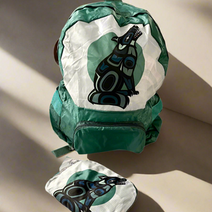 Green and white backpack with a black and blue design on a white background