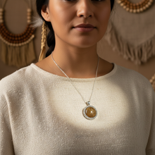 Load image into Gallery viewer, Daring Pendant on Indigenous model - cream blouse