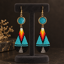 Load image into Gallery viewer, Earrings on a charcoal velvet display