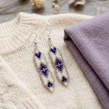 Load image into Gallery viewer, Earrings styled with knitwear and a lavender scarf