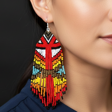 Load image into Gallery viewer, Fancy Dancer Earrings close-up - navy blue blouse