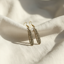 Load image into Gallery viewer, Feather Earrings - white linen lifestyle