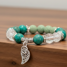 Load image into Gallery viewer, Green Howlite Fancy Feather Bracelet on Walnut Ledge