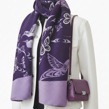 Load image into Gallery viewer, Person wearing a purple scarf with bird pattern and matching handbag on a white background