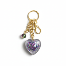 Load image into Gallery viewer, Mocs N More - Glitter Heart Keychain with Purple &amp; Green Glass Bead Charm