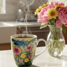Load image into Gallery viewer, Dreamcatcher mug on a bright kitchen counter with morning light and fresh flowers