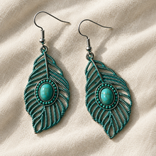 Load image into Gallery viewer, Close-up of Turquoise Willow Leaf Earrings on ivory linen