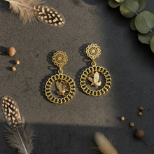 Load image into Gallery viewer, Soaring Eagle Filigree Hoop Earrings flat lay on textured surface