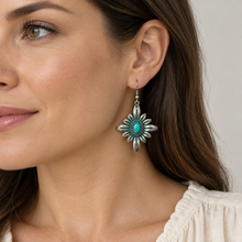 Load image into Gallery viewer, Turquoise Sunburst Flower Earring worn with a cream blouse