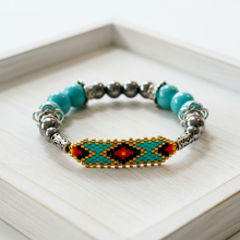Load image into Gallery viewer, Indigenous bracelet on white wood jewelry tray
