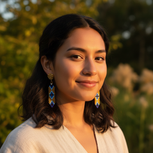 Load image into Gallery viewer, Indigenous model wearing Creator's Garden earrings - outdoor
