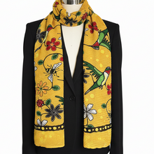 Load image into Gallery viewer, Yellow patterned scarf on a black jacket with a white background