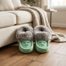 Load image into Gallery viewer, Mint moccasins beside a cream sofa