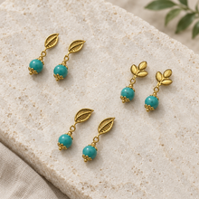 Load image into Gallery viewer, Nature-inspired earrings flat lay