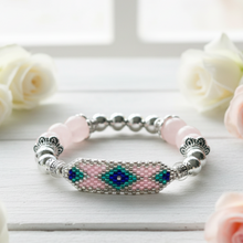 Load image into Gallery viewer, Rose quartz bracelet on white board - variation 2