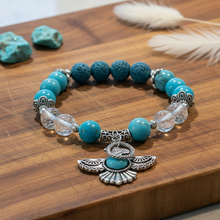 Load image into Gallery viewer, Turquoise Thunderbird bracelet on cutting board