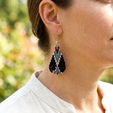 Load image into Gallery viewer, Wind Talker earring worn with a cream linen blouse